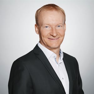 Portrait of Joachim Rath, looking friendly into the camera.