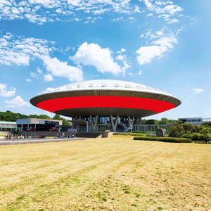 Distinctive circular building with a striking red ring in Eindhoven.