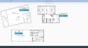 Screenshot des SAP Factory Monitor-Tools mit detaillierter Fabrikansicht, die interaktive Grundrisse verschiedener Gebäudebereiche mit Statusmeldungen und Arbeitsplatzinformationen zeigt.